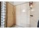 Shower with light tiled walls and a dark shower head and handle at 5385 Ravendale Cir, Las Vegas, NV 89120