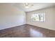 Spacious bedroom featuring hardwood floors, a ceiling fan, and a bright window at 5452 Green Palms St, Las Vegas, NV 89130