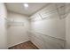 Walk-in closet with shelving and hardwood flooring at 5452 Green Palms St, Las Vegas, NV 89130