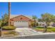 Beautiful single-Gathering house featuring a pristine lawn, mature landscaping, and a convenient two-car garage at 5452 Green Palms St, Las Vegas, NV 89130