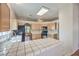 Bright kitchen with tiled countertops and modern black appliances at 5452 Green Palms St, Las Vegas, NV 89130