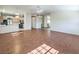 Bright living room with tile flooring and open layout to kitchen with black appliances at 5452 Green Palms St, Las Vegas, NV 89130