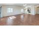 Bright living room with tile flooring and an open layout to kitchen with modern appliances at 5452 Green Palms St, Las Vegas, NV 89130