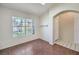 Well-lit room with ceramic tile flooring, a large window, and neutral colors, providing a comfortable space at 5452 Green Palms St, Las Vegas, NV 89130