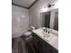 Bathroom featuring a tub and shower combo and laminate flooring at 5525 W Flamingo Rd # 1020, Las Vegas, NV 89103