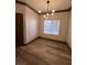 Dining room featuring laminate flooring and a modern light fixture at 5525 W Flamingo Rd # 1020, Las Vegas, NV 89103