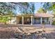 Backyard featuring stone perimeter and covered patio at 5601 Cavalier Cir, Las Vegas, NV 89130