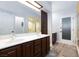 Bathroom featuring dual sinks and updated shower at 5601 Cavalier Cir, Las Vegas, NV 89130