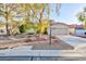 Charming single-story home featuring a two car garage and low maintenance desert landscaping at 5601 Cavalier Cir, Las Vegas, NV 89130