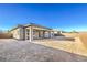 View of a newly constructed backyard with a covered patio and block wall at 567 Jerry Bird Ct, Las Vegas, NV 89123