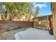 Desert landscaped backyard, with a covered patio, and concrete, separated by a block wall at 5976 Ancona Dr, Las Vegas, NV 89141