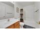 Bathroom with tub-shower combo, toilet and single sink vanity at 5976 Ancona Dr, Las Vegas, NV 89141