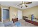 Tan bedroom with a ceiling fan and an adjacent room at 5976 Ancona Dr, Las Vegas, NV 89141