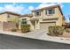 Charming two-story home with a two-car garage and a well-manicured front yard at 5976 Ancona Dr, Las Vegas, NV 89141