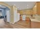 Well-lit kitchen featuring light-colored cabinets and wood-look flooring at 5976 Ancona Dr, Las Vegas, NV 89141