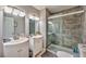 This bathroom features a double vanity sink and shower at 5990 Mcleod Dr, Las Vegas, NV 89120