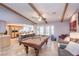 Entertaining game room featuring a pool table with an open floorplan to the kitchen at 5990 Mcleod Dr, Las Vegas, NV 89120