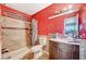 Bathroom with a tub and shower combination, single sink vanity and tile flooring at 604 Canyon Rd, Henderson, NV 89002