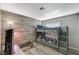 Cozy bedroom featuring a bunk bed, wood-look accent wall and neutral tones at 604 Canyon Rd, Henderson, NV 89002