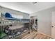 bedroom featuring a bunk bed, wood-look vinyl floors, and ample closet space at 604 Canyon Rd, Henderson, NV 89002