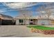 Inviting single-story house featuring low maintenance desert landscaping and covered entryway at 604 Canyon Rd, Henderson, NV 89002