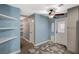 Hallway with ceiling fan, shelving, and access to backyard at 604 Canyon Rd, Henderson, NV 89002