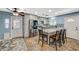 Well-lit kitchen with stainless steel appliances, granite countertops, and a breakfast bar at 604 Canyon Rd, Henderson, NV 89002