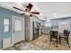 Well-lit kitchen area with stainless steel appliances, breakfast bar, and backyard access at 604 Canyon Rd, Henderson, NV 89002