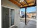 Covered patio area with sliding glass door that leads to the interior of the house at 604 Canyon Rd, Henderson, NV 89002