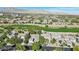 Overhead shot of houses nestled beside a golf course with a stunning mountain range at 613 Pinnacle Heights Ln, Las Vegas, NV 89144