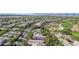 Overhead shot showcasing a community adjacent to a golf course with desert landscape at 613 Pinnacle Heights Ln, Las Vegas, NV 89144