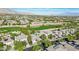 Elevated view of a residential neighborhood near a golf course featuring mature trees at 613 Pinnacle Heights Ln, Las Vegas, NV 89144