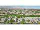 Scenic overhead view of a residential area bordering a golf course with mountains in the background at 613 Pinnacle Heights Ln, Las Vegas, NV 89144