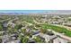 Expansive aerial view of a neighborhood near a golf course with a mountain backdrop at 613 Pinnacle Heights Ln, Las Vegas, NV 89144