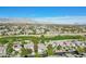 Panoramic aerial shot of a community with golf course views and mountain scenery at 613 Pinnacle Heights Ln, Las Vegas, NV 89144