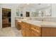 Bathroom with tiled floors and counter tops, double sinks, and a walk in closet at 613 Pinnacle Heights Ln, Las Vegas, NV 89144