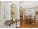 Inviting dining room with a wood table, chandelier, and hardwood floors at 613 Pinnacle Heights Ln, Las Vegas, NV 89144