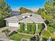 Charming single-Gathering home with a well-maintained lawn and mature landscaping at 613 Pinnacle Heights Ln, Las Vegas, NV 89144