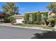 Beautiful single-story home featuring a two-car garage, brick driveway, and manicured landscaping at 613 Pinnacle Heights Ln, Las Vegas, NV 89144