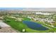 A golf course with a lake and sand traps offers a serene environment with the mountains as a backdrop at 613 Pinnacle Heights Ln, Las Vegas, NV 89144