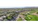 An elevated view shows a golf course bordering single-Gathering homes and a desert landscape at 613 Pinnacle Heights Ln, Las Vegas, NV 89144