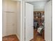 Home office featuring a desk, custom shelves, a comfortable gray chair and hardwood floors at 613 Pinnacle Heights Ln, Las Vegas, NV 89144