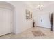 Inviting entryway featuring tile floors, neutral walls, decorative accents, and a chandelier at 6608 Ringbill Ct, North Las Vegas, NV 89084