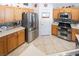 Bright kitchen featuring stainless steel appliances and tile flooring at 6608 Ringbill Ct, North Las Vegas, NV 89084