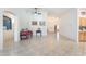 Spacious living room featuring tile flooring, neutral walls, archways, and an open layout at 6608 Ringbill Ct, North Las Vegas, NV 89084