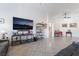 Large living room featuring a media center, tile flooring, and an open layout perfect for entertaining at 6608 Ringbill Ct, North Las Vegas, NV 89084