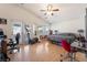 Spacious main bedroom with a ceiling fan, hardwood floors, and a door to the patio at 6608 Ringbill Ct, North Las Vegas, NV 89084