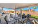 Covered patio overlooking pool and landscaped backyard, perfect for outdoor relaxation at 6608 Ringbill Ct, North Las Vegas, NV 89084