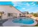 Backyard pool surrounded by greenery and patio space, ideal for entertaining at 6608 Ringbill Ct, North Las Vegas, NV 89084