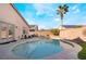 Backyard pool with landscaping and a grassy area, perfect for enjoying sunny days at 6608 Ringbill Ct, North Las Vegas, NV 89084